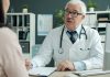 Doctor talking to patient in an office