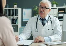 Doctor talking to patient in an office