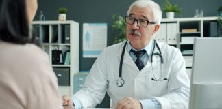 Doctor talking to patient in an office