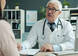 Doctor talking to patient in an office
