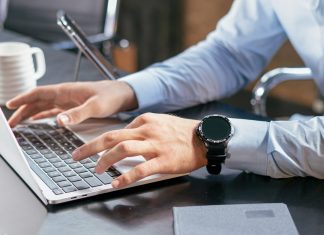 How to Permanently Erase Files So They Can’t Be Recovered A person typing on a laptop at a desk