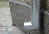 a close up of a metal object on a wall