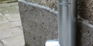 a close up of a metal object on a wall