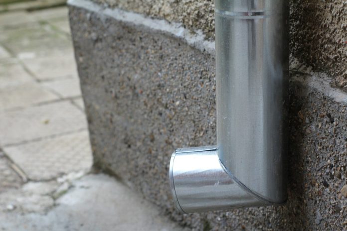 Photo by Georgi Zvezdov a close up of a metal object on a wall
