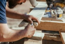 How To Document Contractor Costs For Government Tax Incentive Programs a man working on a piece of wood