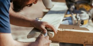 a man working on a piece of wood