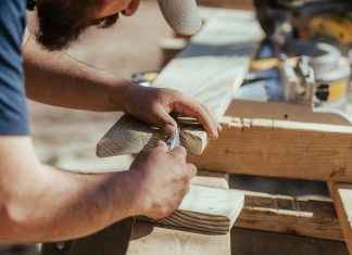 a man working on a piece of wood