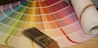 brown paint brush on white and red plaid textile