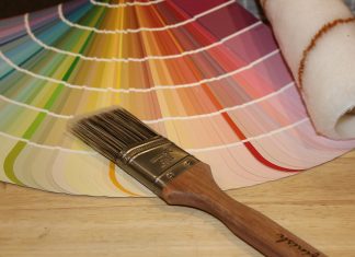 brown paint brush on white and red plaid textile