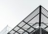 What Are the Structural Advantages of Pre-Engineered Steel Buildings in Canada black metal frame under white sky during daytime
