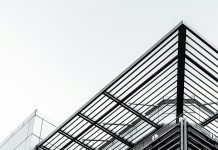 What Are the Structural Advantages of Pre-Engineered Steel Buildings in Canada black metal frame under white sky during daytime