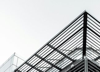 What Are the Structural Advantages of Pre-Engineered Steel Buildings in Canada black metal frame under white sky during daytime