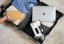 Packing Smart for Long Flights and Travel Layovers An open suitcase with a laptop and other items