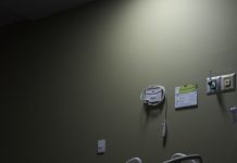 Common Reasons Wrongful Death Claims Face Delays in Denver An empty hospital bed sits in a dimly lit room.