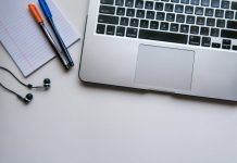 Why SCORM Compliance Matters for Online Course Delivery silver laptop computer beside white ruled paper