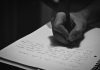Turn a Dream Fragment Into a Short Creative Writing Exercise A person writing on a notebook with a pen