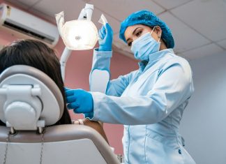 How Dental Professionals Use Botox Beyond Traditional Cosmetic Goals a woman getting her teeth brushed by a dentist