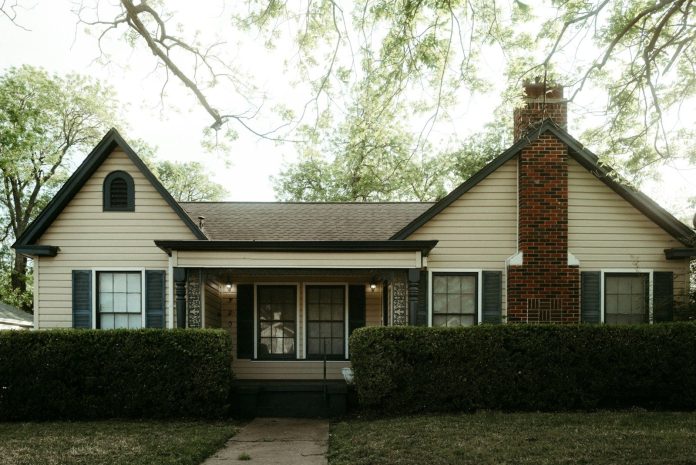 Photo by Daniel a house with a brick chimney