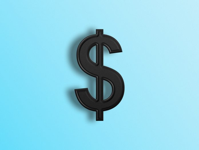 Photo by Woliul Hasan a black dollar sign on a blue background