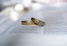 How Fantasy-Film-Inspired Wedding Bands Add Meaning to a Ceremony gold diamond ring on white printer paper