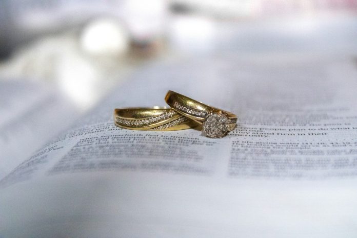 Photo by Anna Might gold diamond ring on white printer paper