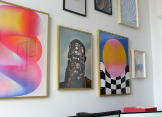 Why Digital Art Prints Appeal to Tech-Savvy and Design-Focused Homeowners a wall with a bunch of paintings on it