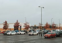 a parking lot filled with lots of parked cars