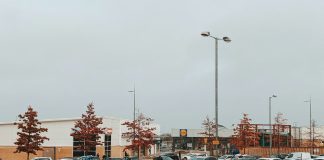 a parking lot filled with lots of parked cars