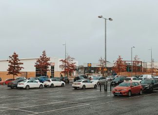 a parking lot filled with lots of parked cars