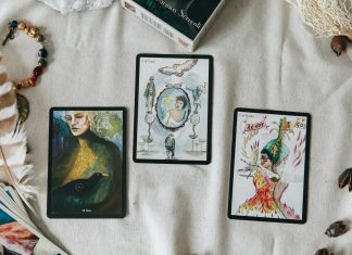 How to Read an Online Psychic Profile With a Clear Head 2 black and white cards on white textile