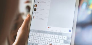 person using white iPad