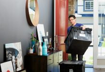 man in blue polo shirt sitting on chair