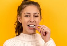 Smile Design Trends for Teens: What Parents Should Know Before the First Consultation smiling woman in white knit sweater