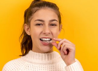 Smile Design Trends for Teens: What Parents Should Know Before the First Consultation smiling woman in white knit sweater