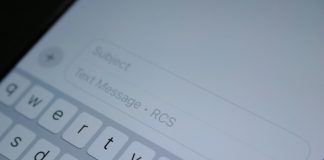A close up of a cell phone with a keyboard