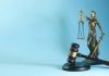 How Do You Prove Liability in a Los Angeles Slip and Fall Case? Lady justice and gavel on a blue background