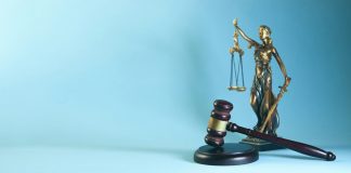 Lady justice and gavel on a blue background