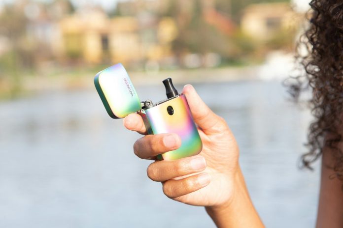 person holding green iphone 5 c