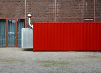 The Benefits of Using Shipping Containers for Cost-Effective Business Storage red and gray metal wall