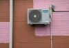 A air conditioner mounted to the side of a building