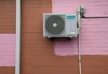 Why Your Furnace Picks the Worst Night to Quit (and How to Stay Ahead of It) A air conditioner mounted to the side of a building