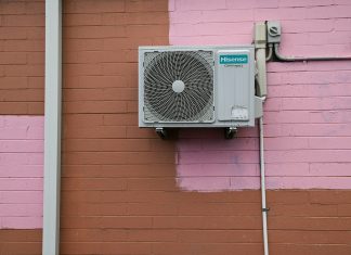 Why Your Furnace Picks the Worst Night to Quit (and How to Stay Ahead of It) A air conditioner mounted to the side of a building