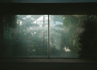 a window with a view of a house through it