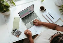 Why Hourly Rate Is the Wrong Number to Shop On for a Small Business Accountant a person sitting at a table with a laptop