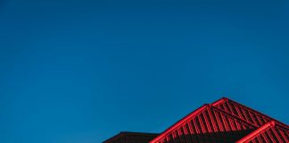 red and black building under blue sky