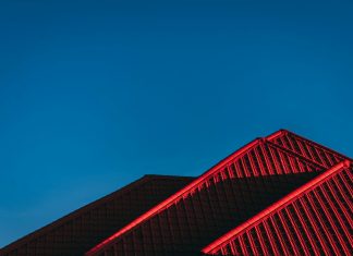 How Roof Color Choices Affect Attic Heat and Energy Costs red and black building under blue sky