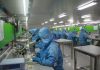 The Future of Pharmaceutical Manufacturing: Innovation Beyond the Lab man in blue jacket wearing blue mask