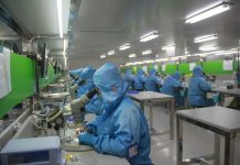 man in blue jacket wearing blue mask