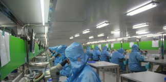 man in blue jacket wearing blue mask