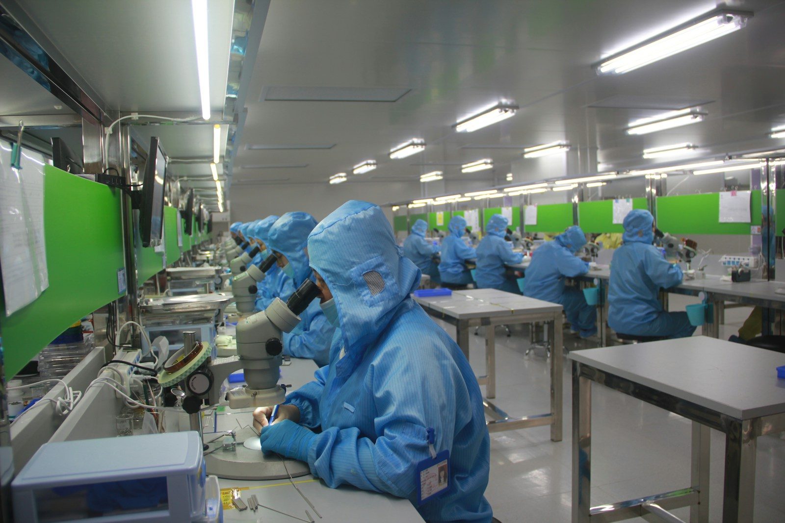 The Future of Pharmaceutical Manufacturing: Innovation Beyond the Lab man in blue jacket wearing blue mask